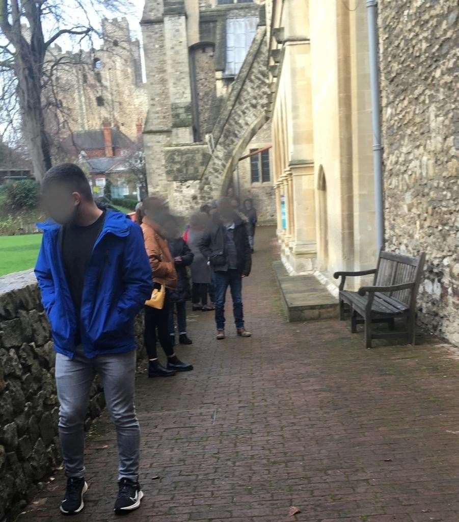 People waiting for a test outside the cathedral in Rochester today as it opened to key workers and selected members of the community invited to book in for a test