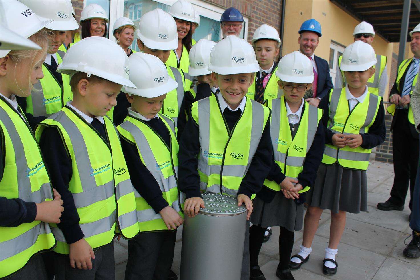 Regis Manor Primary School pupils put the lid on the time capsule