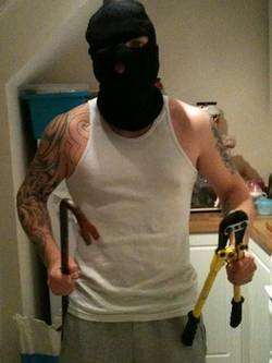 Burglar Danny Stevenson posing with bolt cutters and crowbar in a photo on his mobile phone