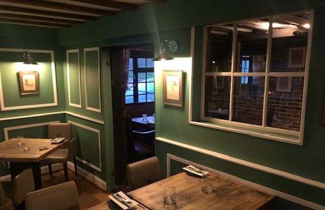 The dining room at the back of the pub has clearly received a makeover and has a very different feel from the other rooms