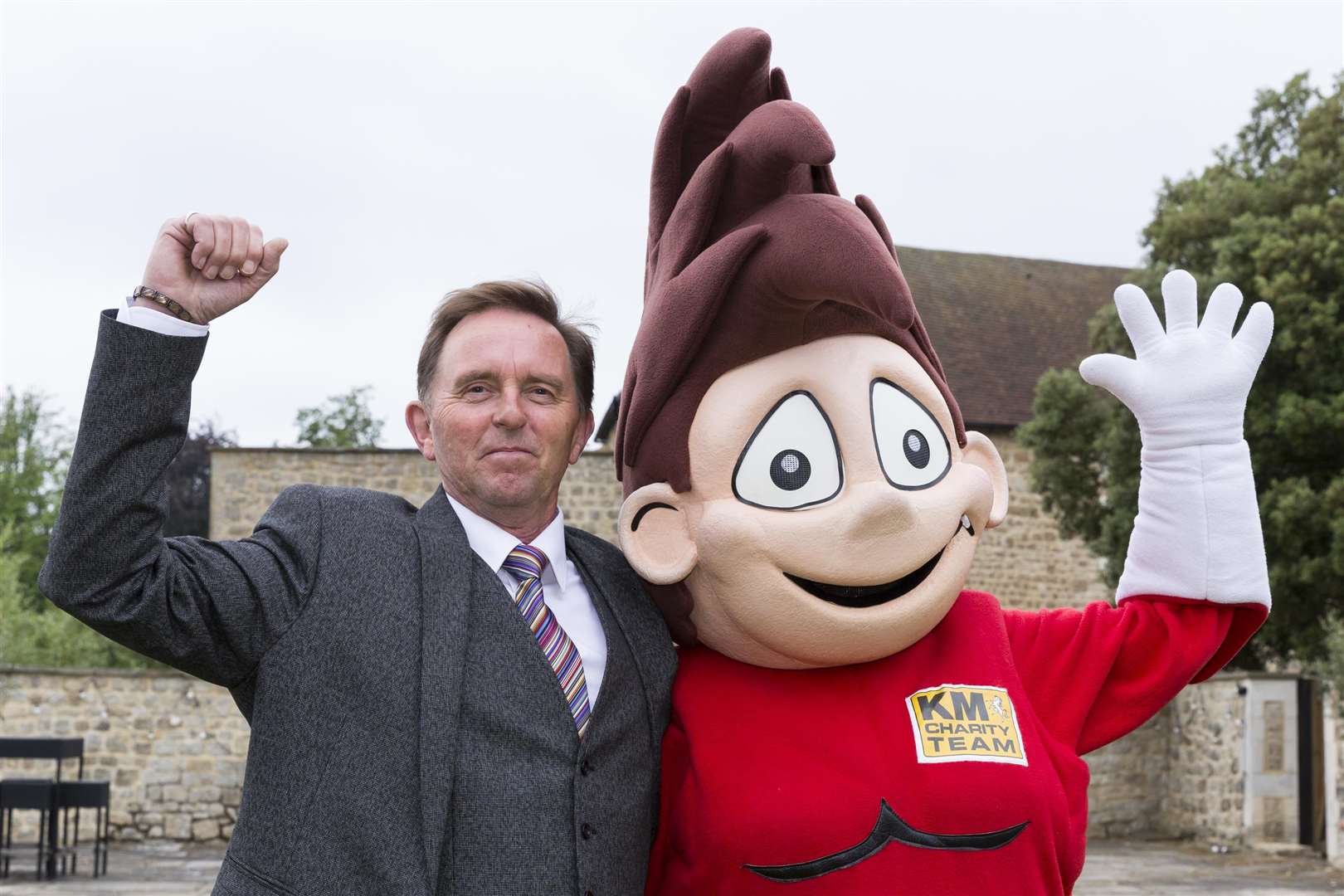 KCC Cllr Derek Mortimer with KM Walk to School mascot Wowzer.