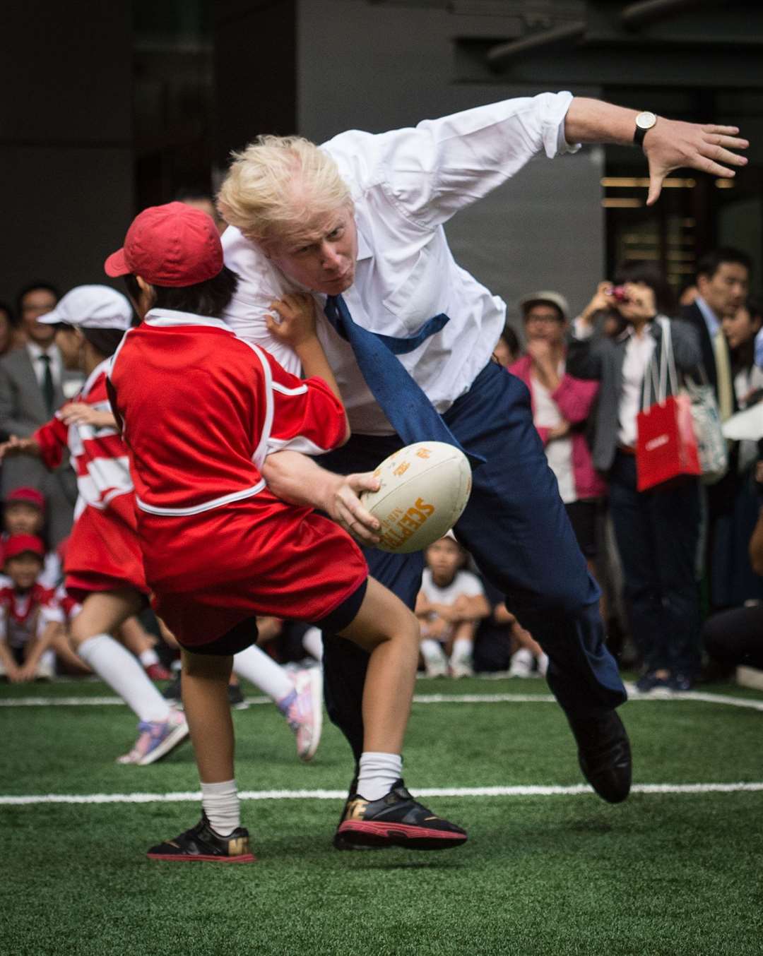 During a street rugby tournament in Tokyo with school children to mark Japan hosting the 2019 Rugby World Cup (Stefan Rousseau/PA)