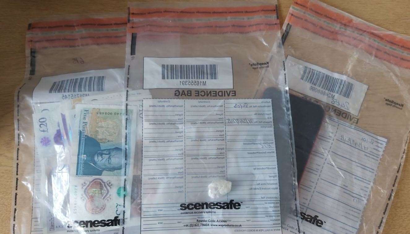 Suspected crack cocaine, cash and a mobile phone were seized by police. Picture: Kent Police