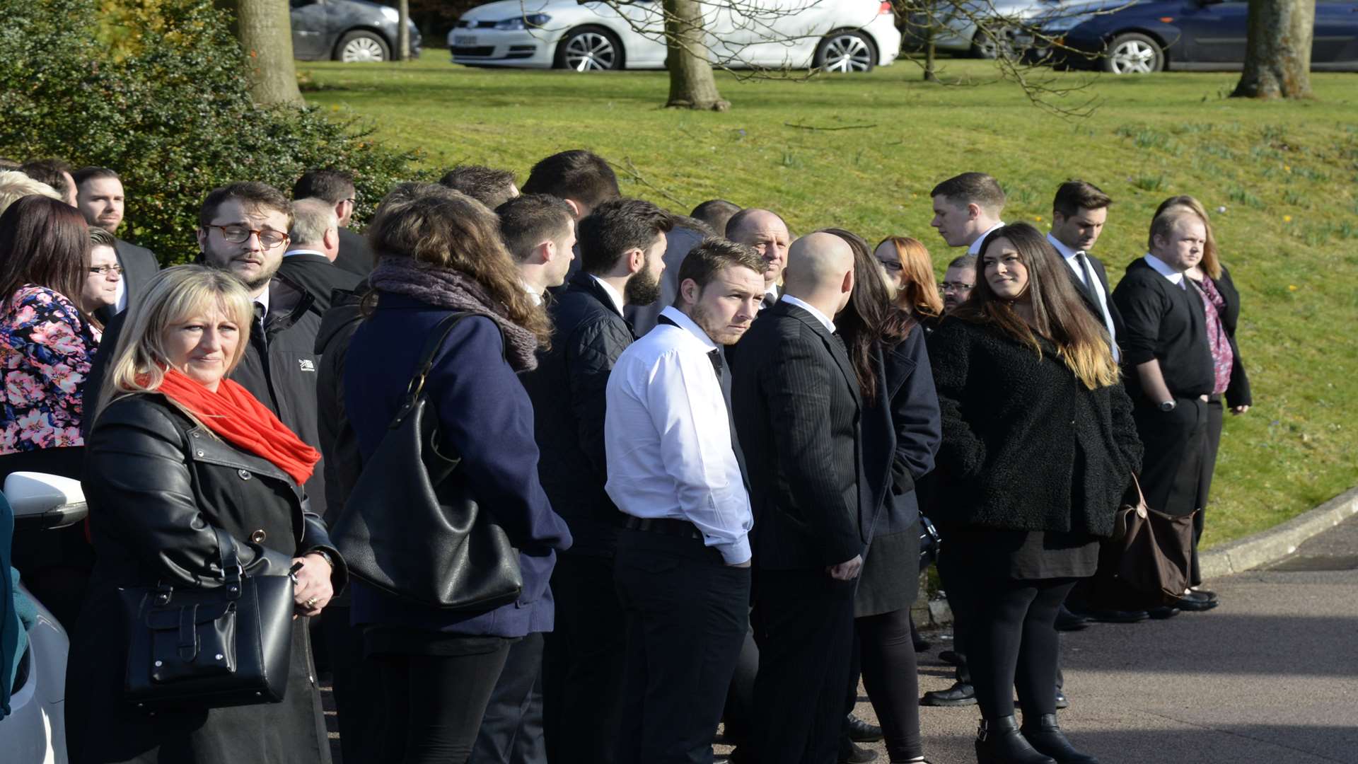 Mourners gather for the funeral of Pat Lamb