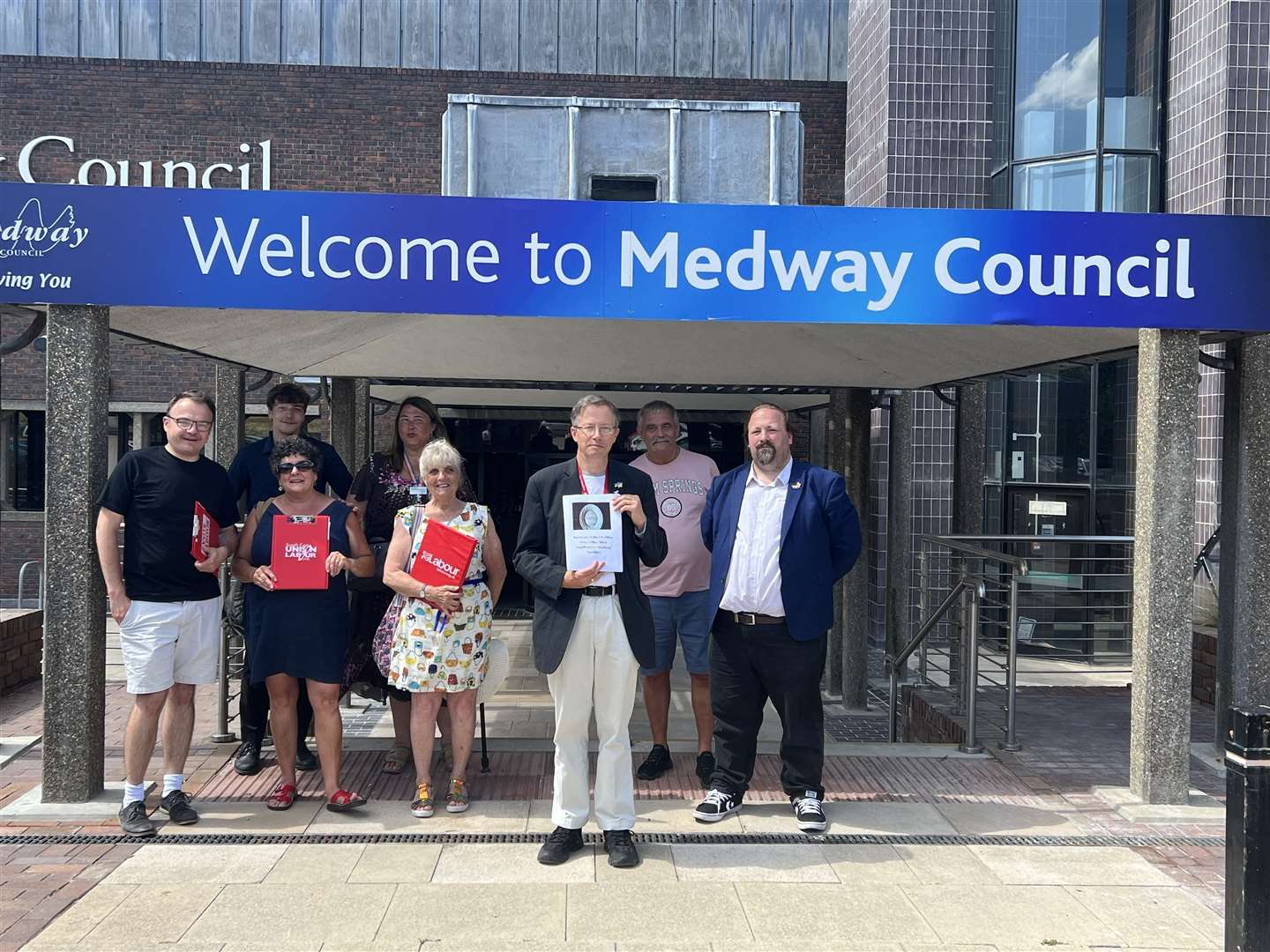 Medway Labour Group members support Cllr Clive Johnson (centre) in handing in his petition