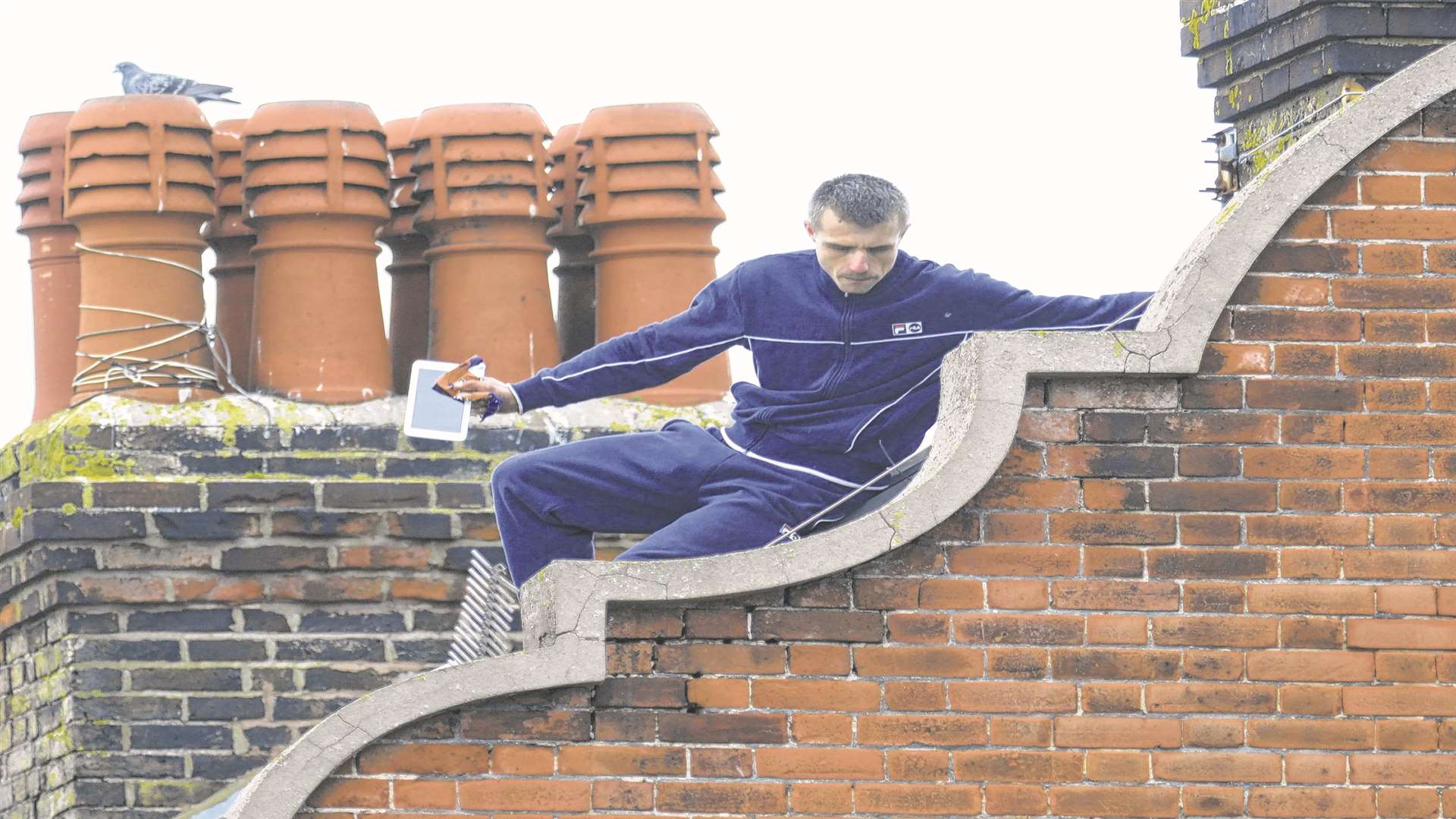 Napierkowski on the roof. Picture: Chris Davey