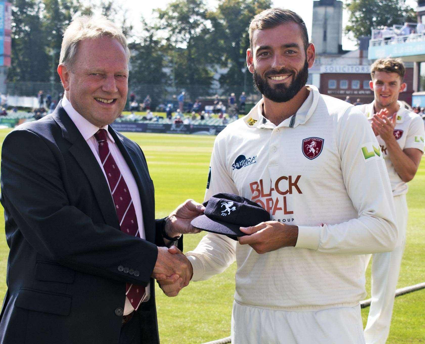 Kent's Jack Leaning is handed his county cap by director of cricket Paul Downton. Picture: Kent Cricket