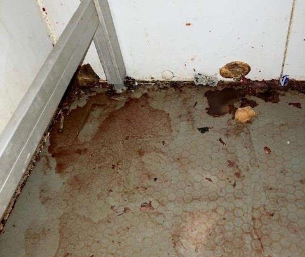 The blood-stained floor formed one of many gruesome discoveries at the takeaway