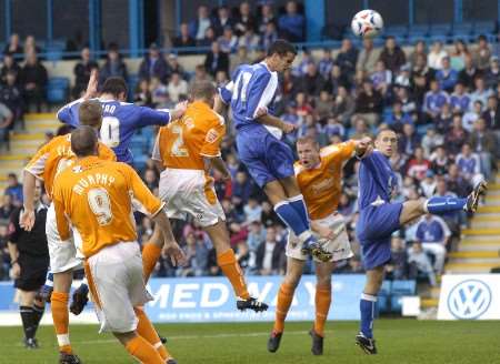 Chris Hope leaps high above the Blackpool defence to head Gills level. Picture: GRANT FALVEY
