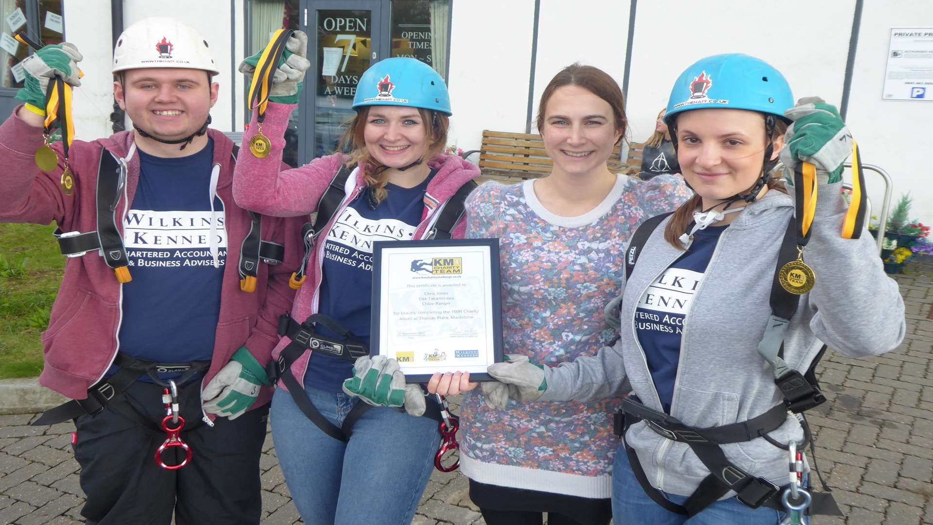Alex Andrews (second right) from Wilkins Kennedy, key partner for the KM Abseil Charity Challenge, congratulates team mates Chris Jones, Chloe Ranger and Dee Takamizawa for completing the challenge.