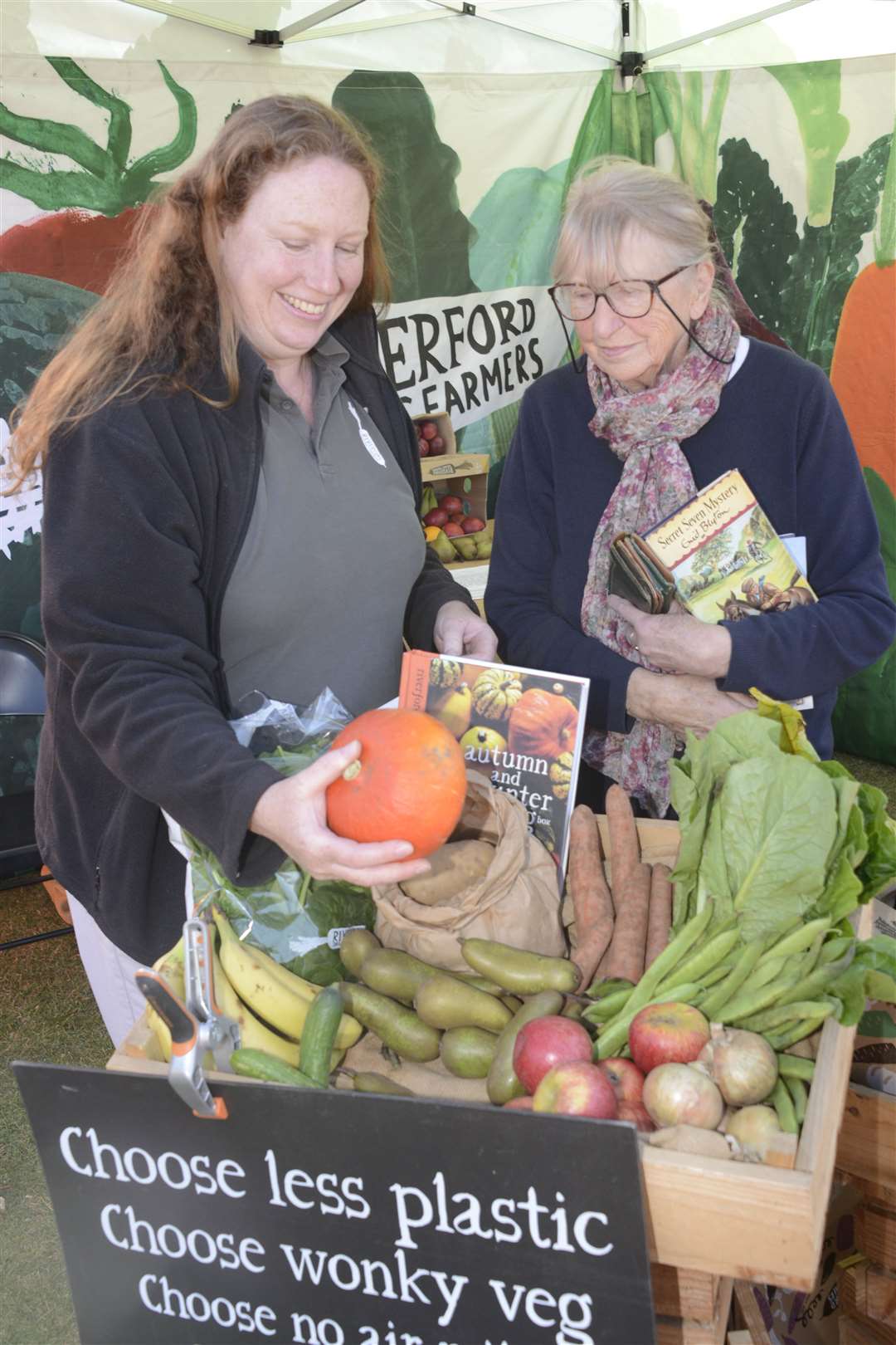 The .Riverfords Organic Farm stall at the Big Urban Fete. Hannah Knowles shows her produce to Patricia Castleton. Picture: Paul Amos.