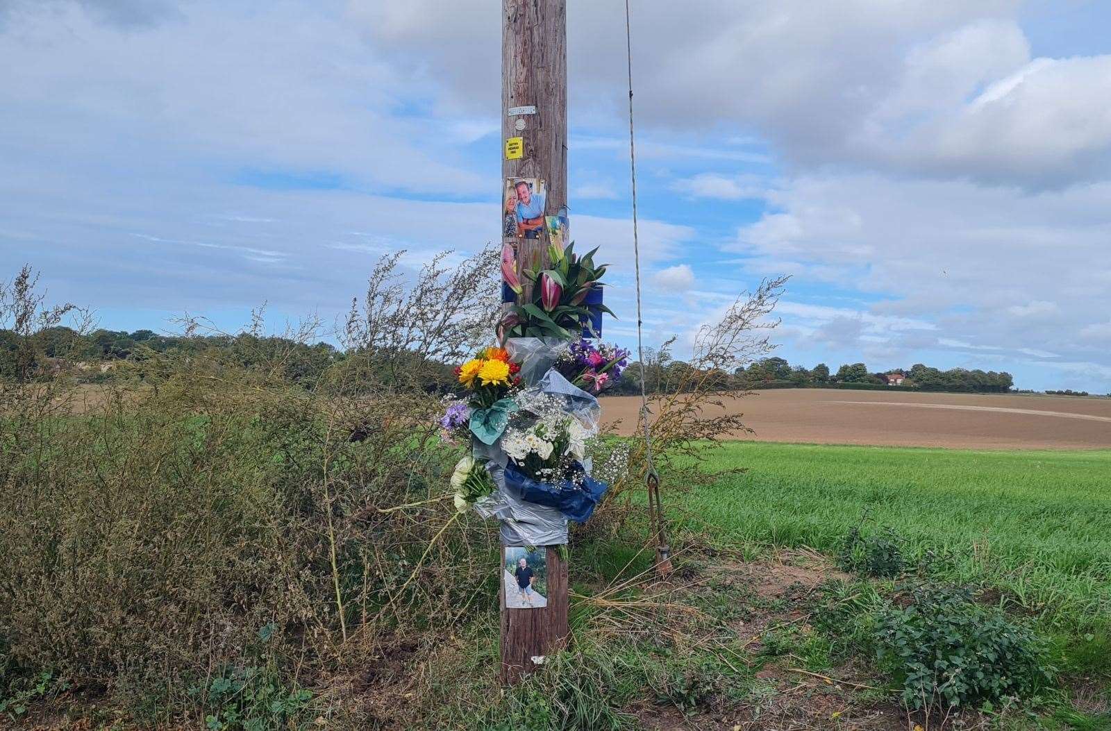 Floral tributes and photographs of the victim have been left at the scene of the crash in Minster