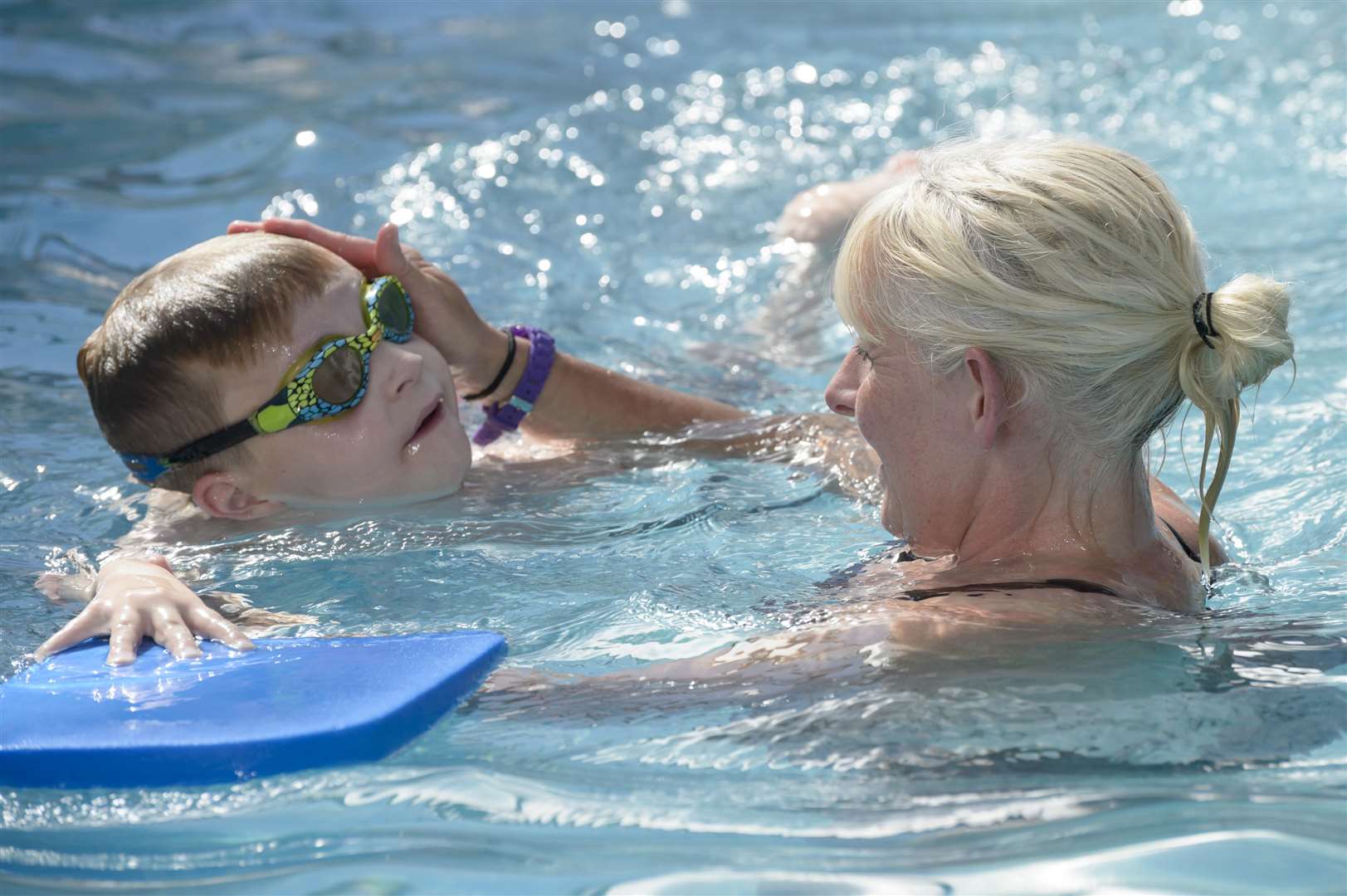 Denise with George, 7. The DC Swim School, run by Denise Calvert at New Barn Road, Longfield, is facing closure after Dartford Council decided planning permission was needed after nine years of the school (and the pool itself being older still). .Picture: Andy Payton. (2746978)