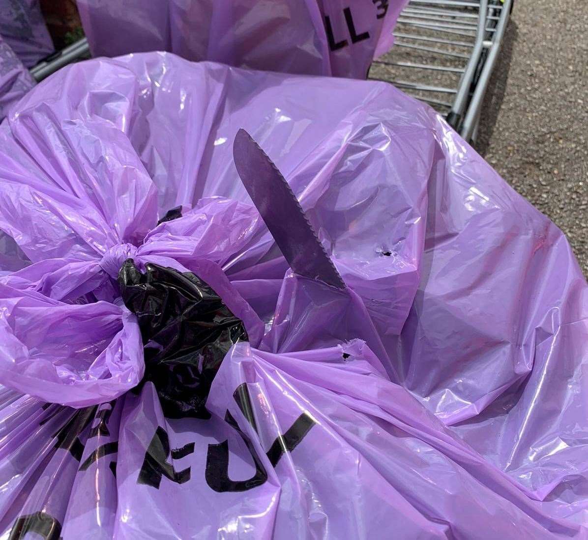 A knife can be seen poking out of a rubbish bag after a Serco crew member was involved in a near-miss. Picture: Canterbury City Council / Twitter