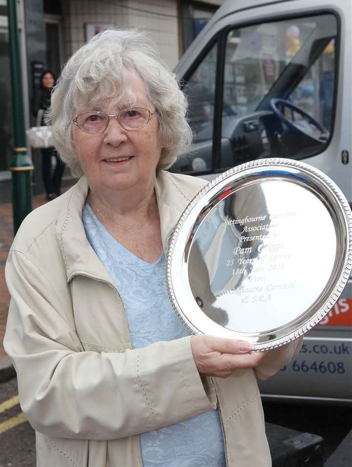 Pam Griggs with a shield to mark serving 25 years of chairing the Sittingbourne Carnival Association. Picture: John Westhrop
