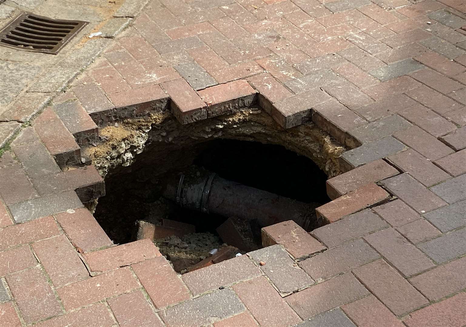 The hole appeared in the middle of St Peter's Street in Canterbury city centre on Sunday morning