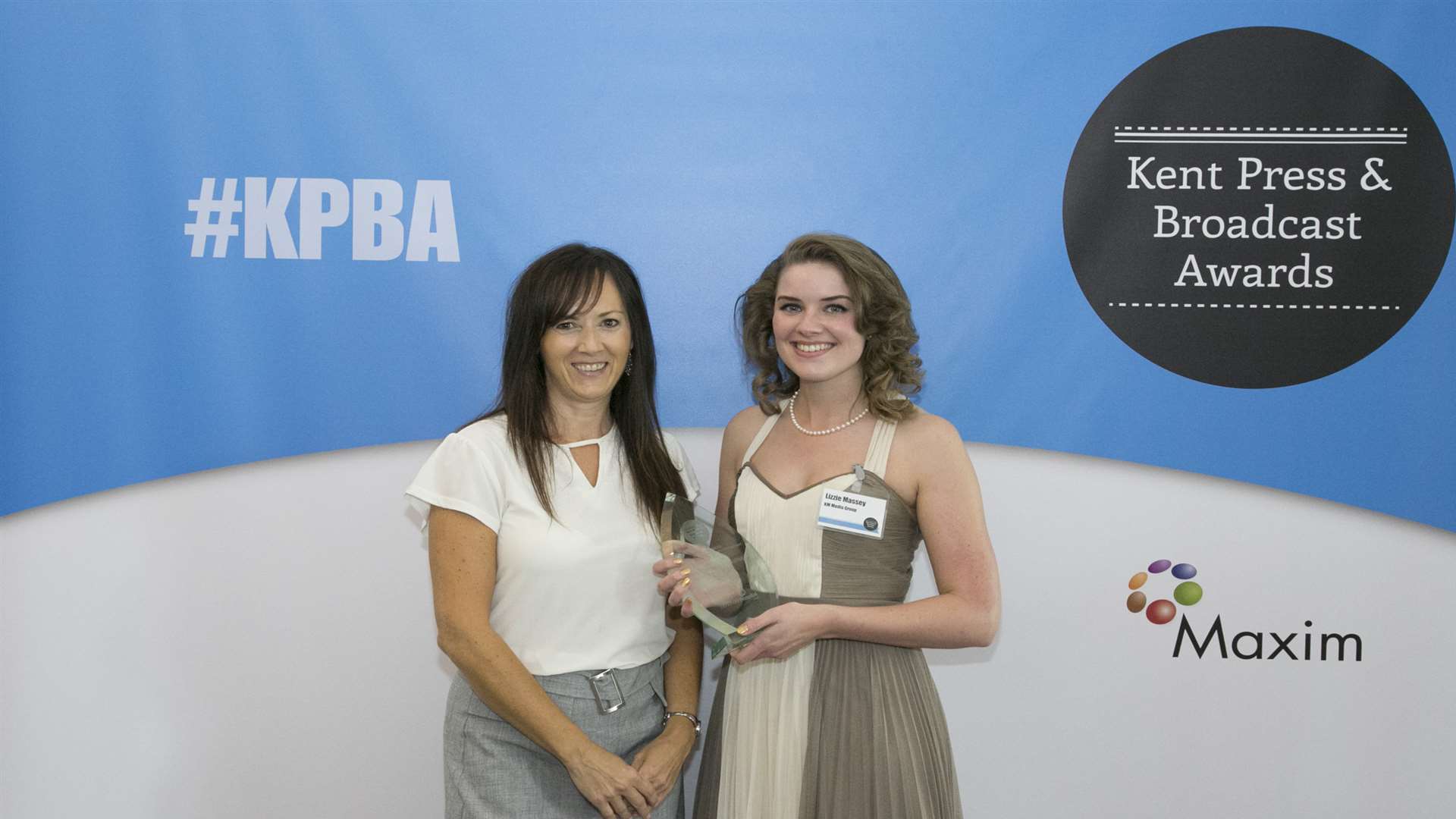 Lizzie Massey collects her award from Jane Barlow from sponsors Benenden Healthcare
