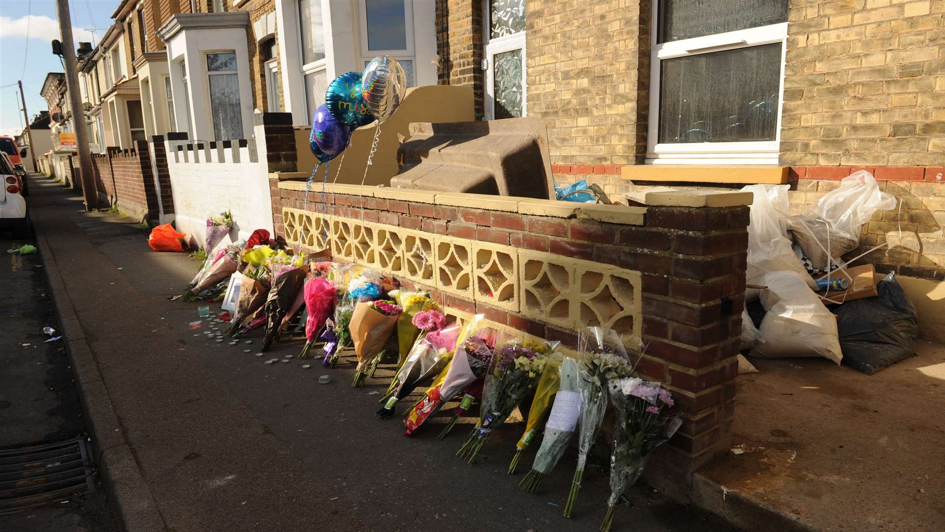 Floral tributes and balloons left at the scene