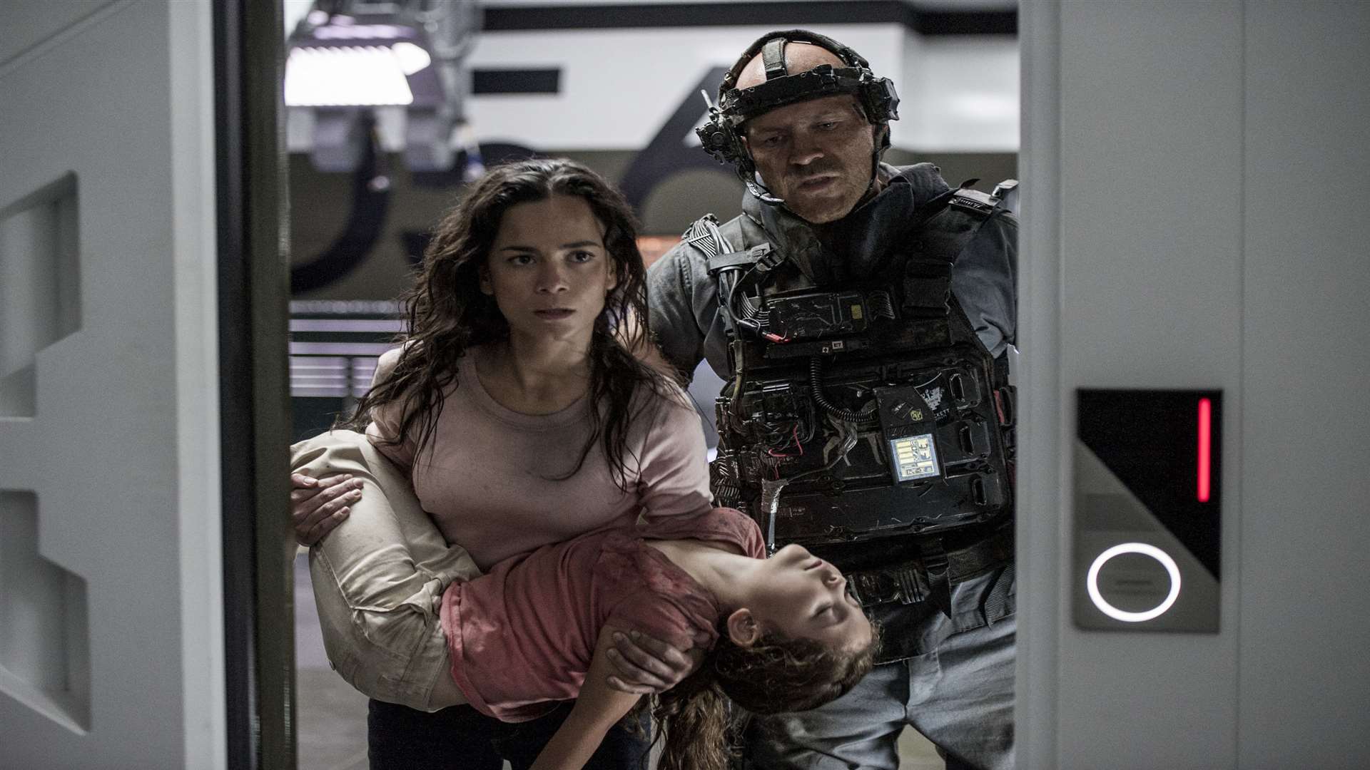 Josh Blacker as Crowe, Alice Braga as Frey and Emma Tremblay as Matilda in Elysium. Picture: PA Photo/Sony Pictures Releasing UK.
