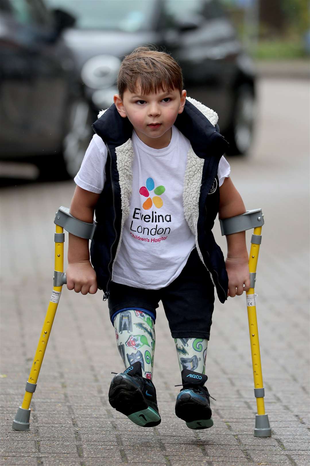Tony Hudgell, then aged just five, takes the final steps in his walk that raised more than £1 million for the hospital which has cared for him since he was four-months-old (Gareth Fuller/PA Wire)