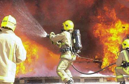 Firefighters battle a blaze