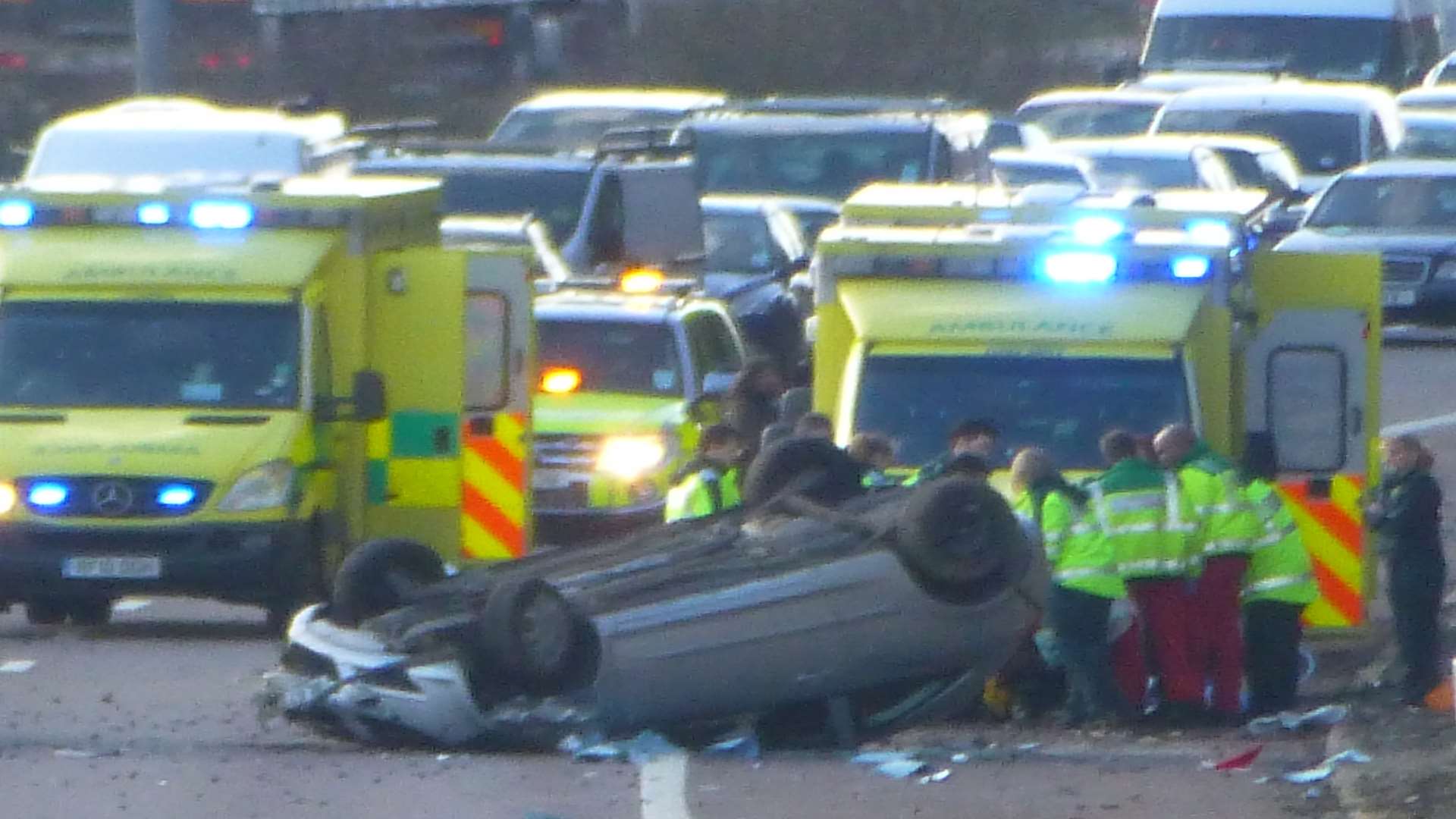Medics at the scene of the overturned car on the M2. Picture: Roselyn Smith