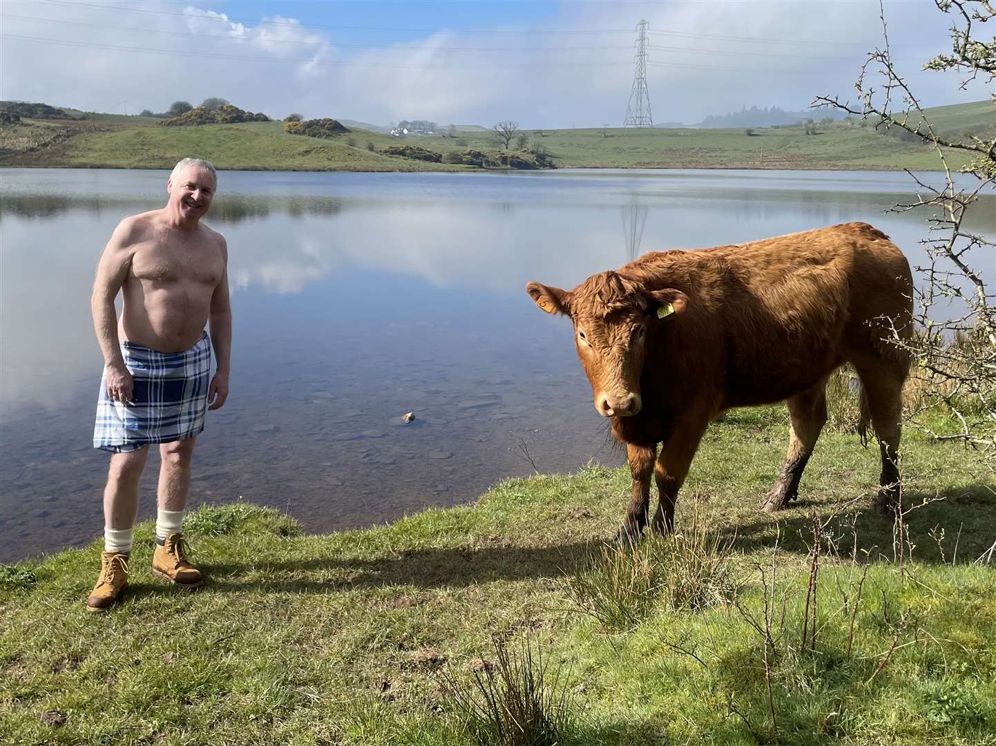 Kenny Sinclair encounters a local cow (Ewan Pringle/PA)