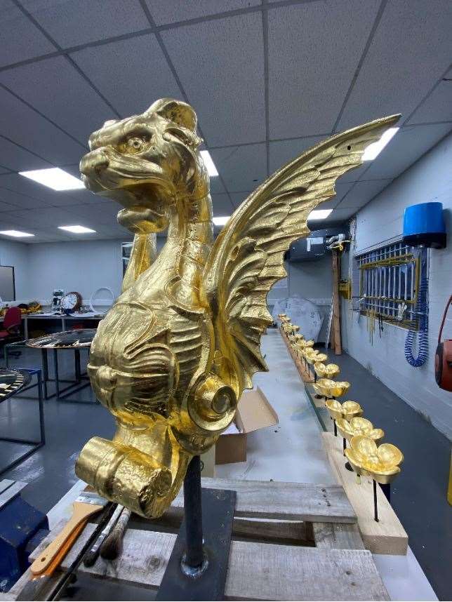 One of the stunning four dragons on the Sheerness clock tower has now been gilded in gold. Picture: Smith of Derby