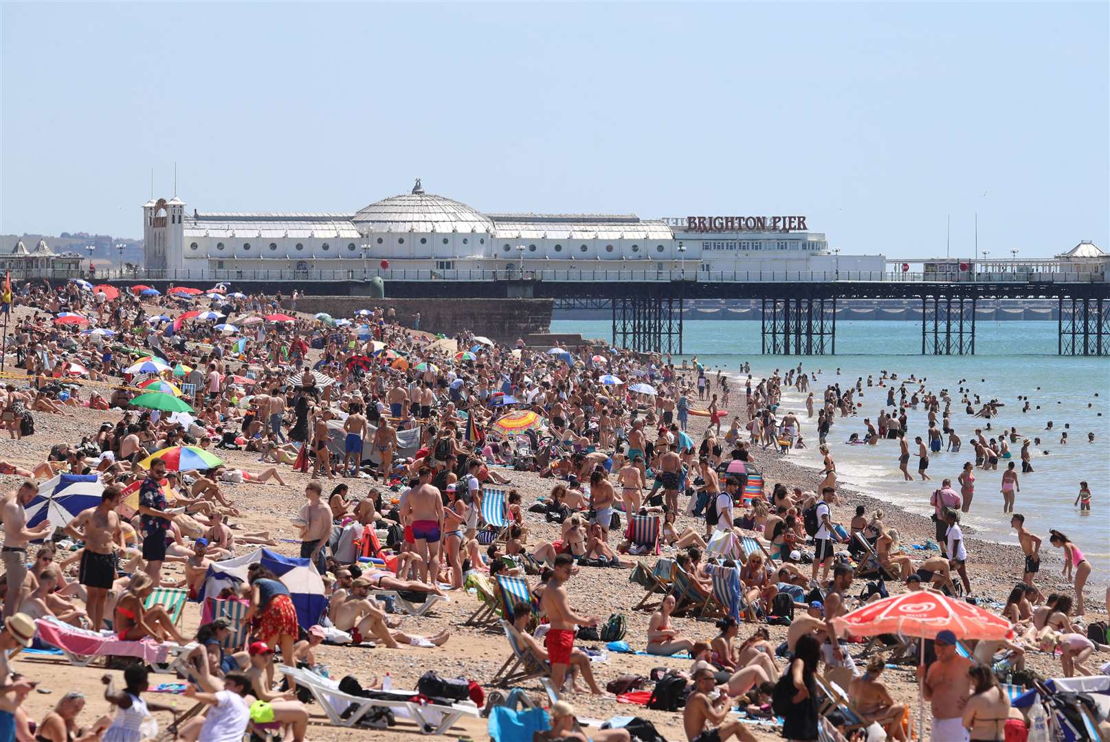 There were large crowds on Brighton beach by mid-morning (Gareth Fuller/PA)