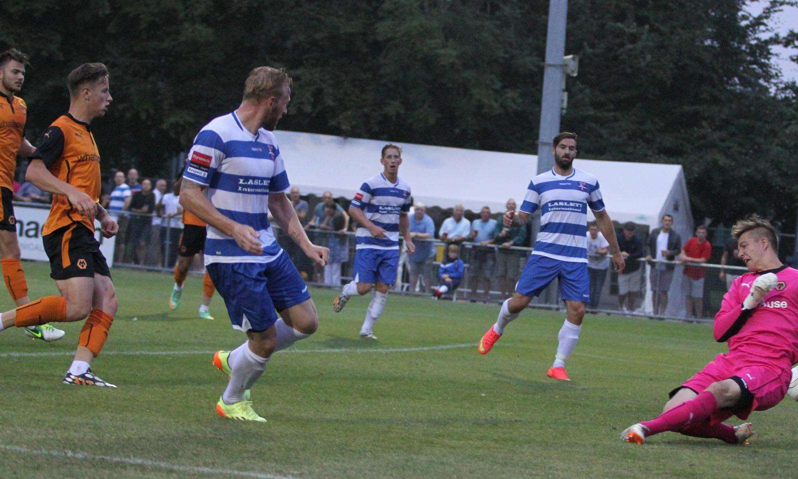 Lewis Taylor scores Margate's third goal against a Wolves XI at Hartsdown Park in last year's meeting Picture: Don Walker