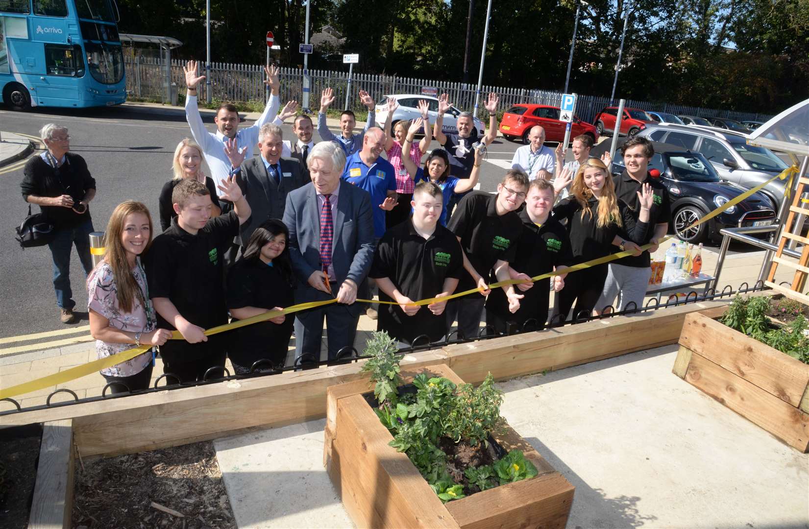 Chris Fribbins, chairman of the Kent Community Rail Partnership, opens the area at Snodland station redeveloped by Five Acre Wood students. Picture:Chris Davey