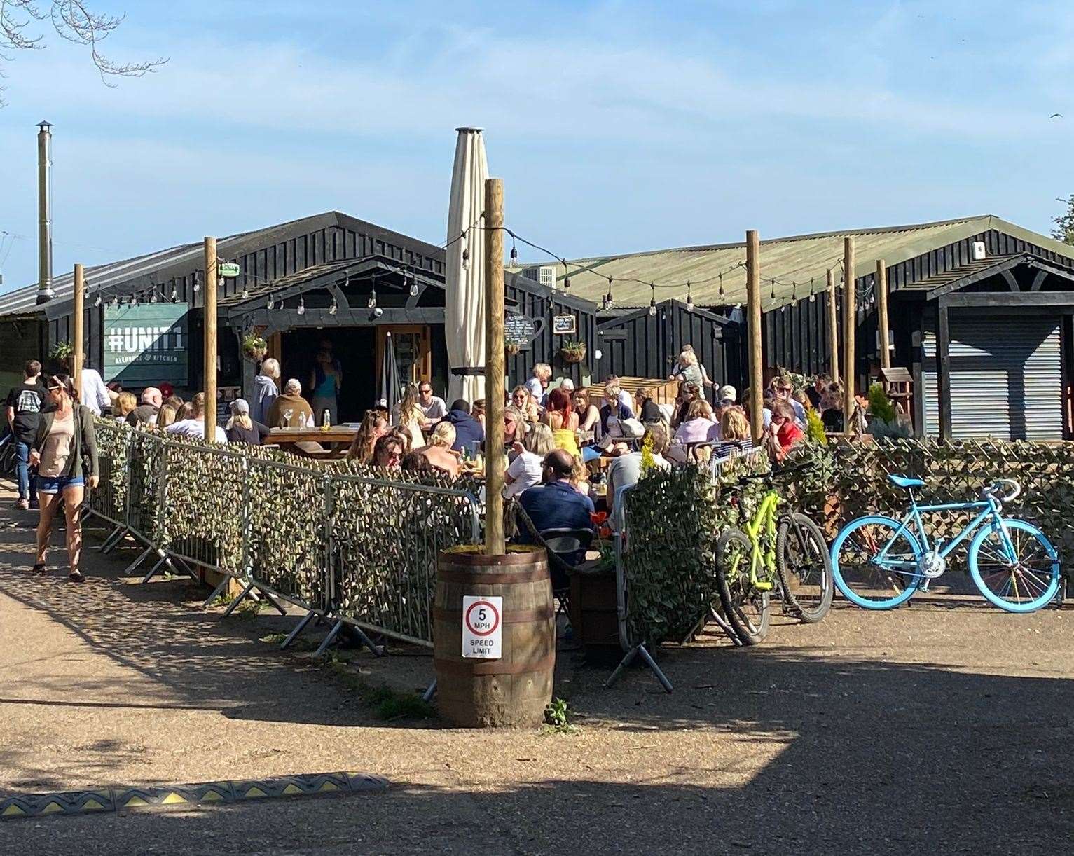 Punters soak up sun outside Unit 1 in West Hythe on Good Friday