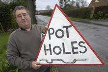 Ted Relf and his doomed pothole sign, in Shadoxhurst, Kent