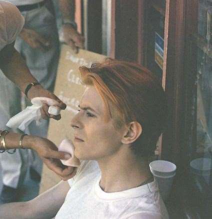 Bowie attended to by make-up artists on the film set of The Man Who Fell to Earth in New Mexico in 1975