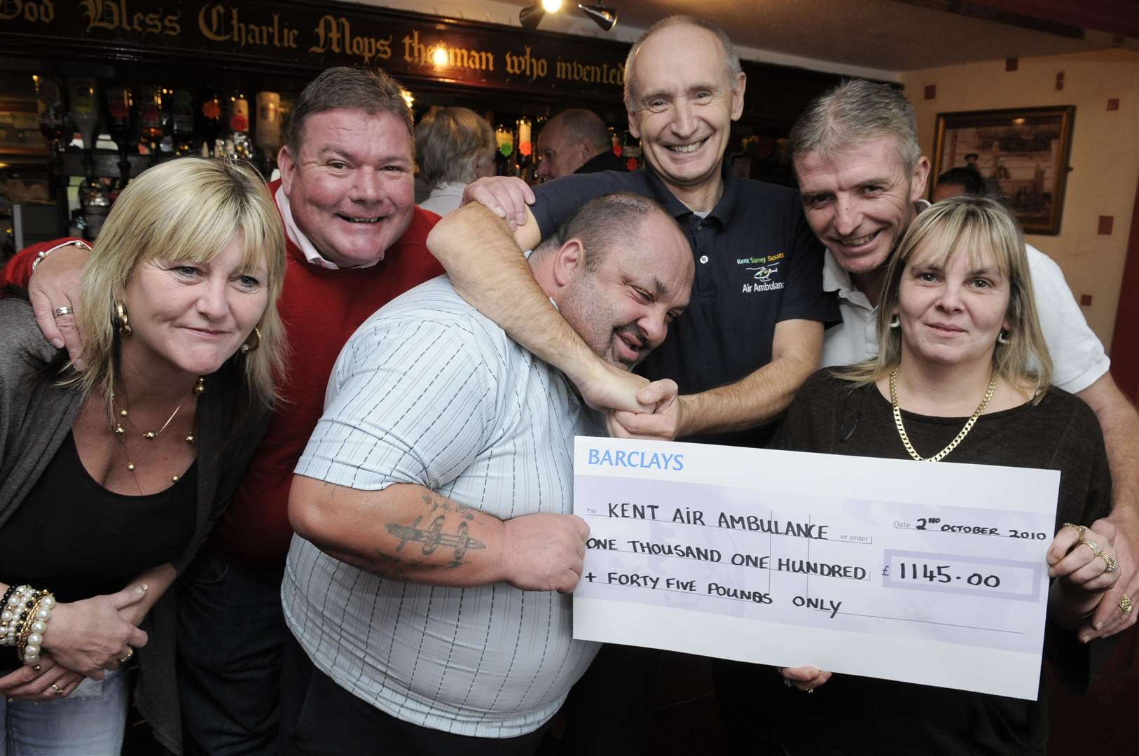 From left, Mandy Attree, Lenny Pailthorpe, Ian "Pitbull" Johnson, Esmond Wyatt from KAA, Lee Reed and Lisa Reed at the Old House at Home in 2010 - the pub hosted a wrestling show and raised thousands for the Kent Air Ambulance. Picture: Andy Payton