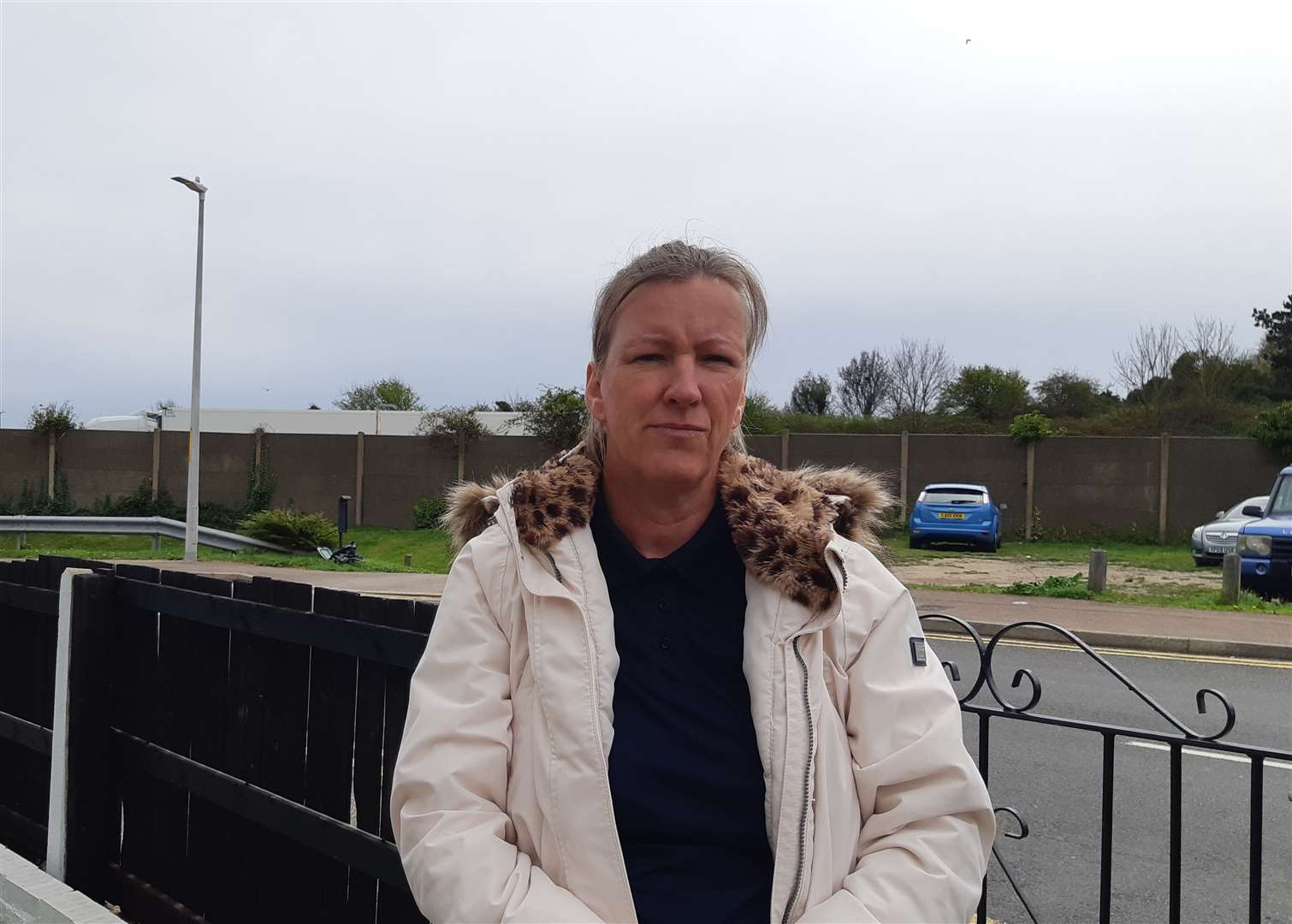 Resident Wendy Hayden with TAP lorries behind a barrier fence. Picture: Sam Lennon