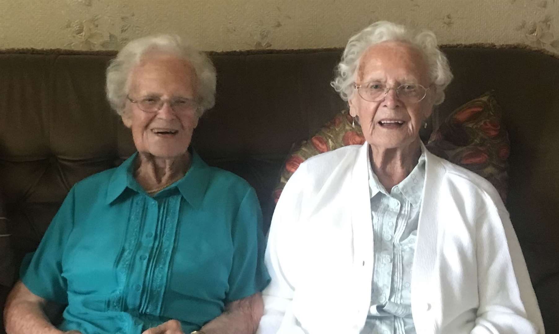 From left, identical twins Kathleen and Dorothy are celebrating their 100th birthday