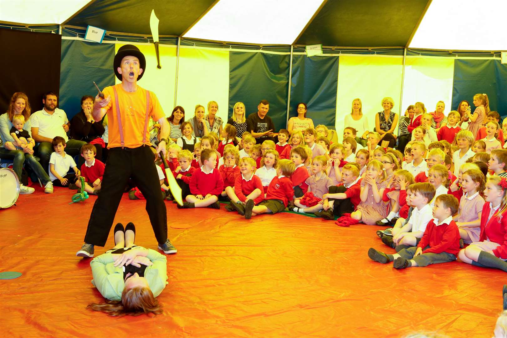 The children look on anxiously as headteacher Ruth Powell is part of the knife juggling act