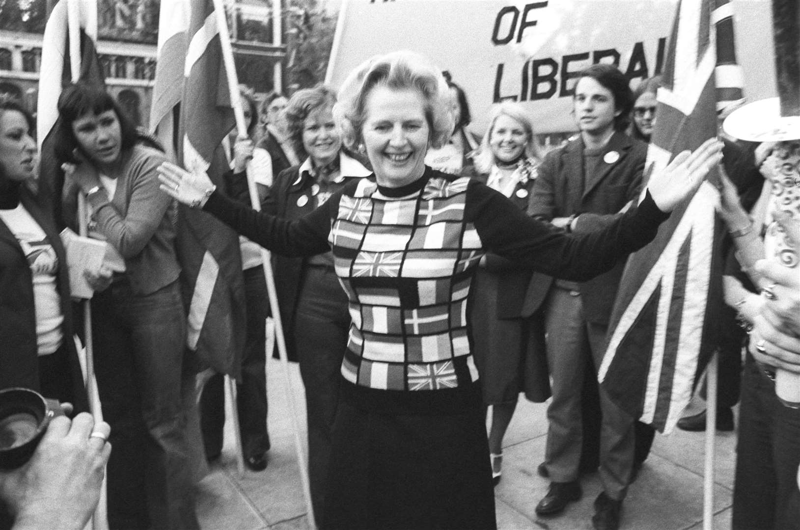 Prime Minister Margaret Thatcher, sporting a sweater bearing the flags of European nations, in Parliament Square during her 'Yes to Europe' campaign Picture: PA