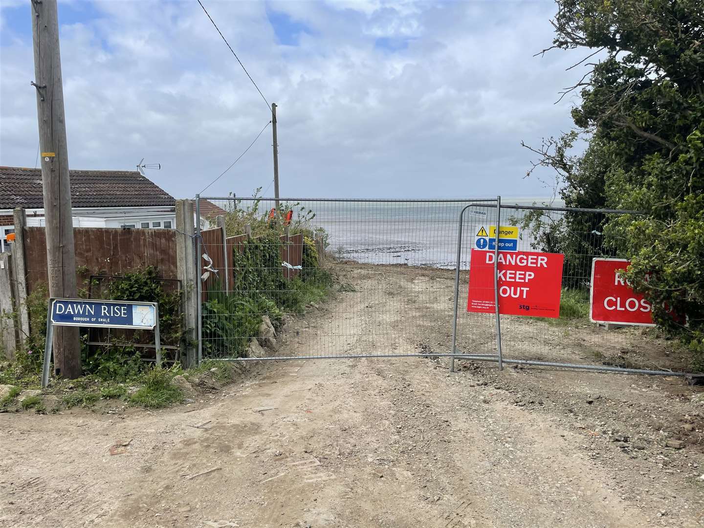 The road cordoned off next to Dawn Rise in Eastchurch almost one year after the huge cliff collapse in May 2020. Picture: Chloe Holmwood