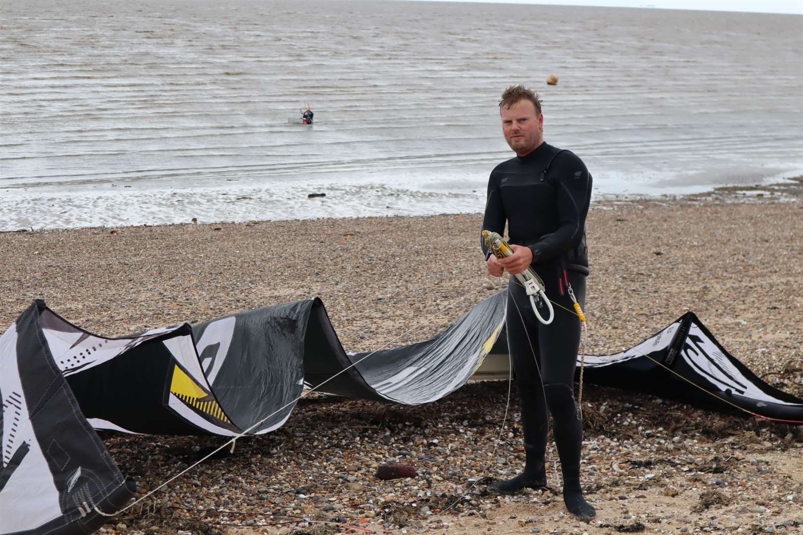 Kite surfer Wayne Sheppard from Dartford back in the water at Minster shingle bank on the Isle of Sheppey