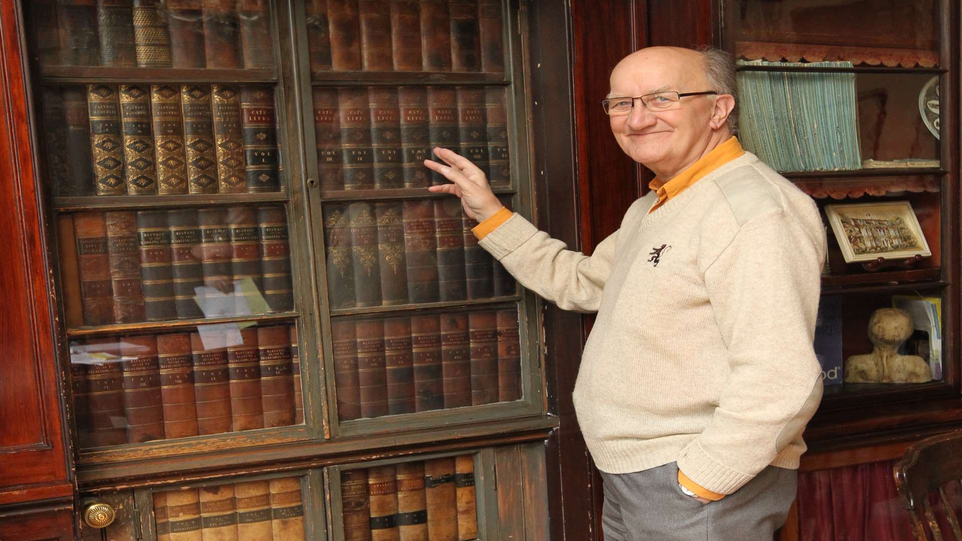 Norman Munn, on the Board of Trustees and a tour guide of Gads Hill Upper School, shows off Dickens's unusual study door. Picture: John Westhrop