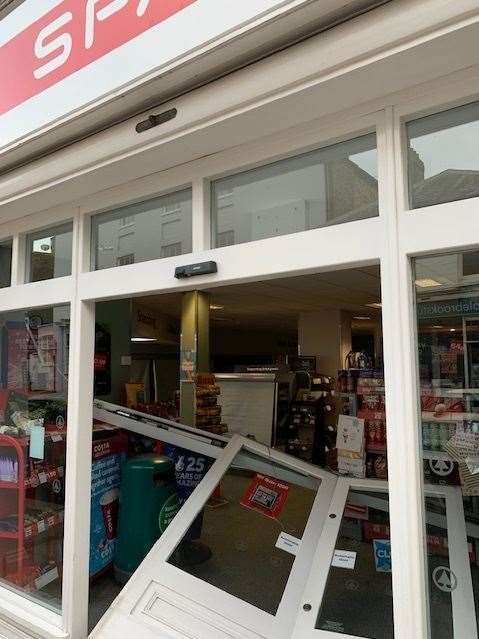 The doors were pushed though leaving the store open Picture: David Wood