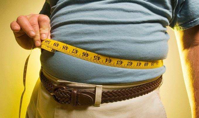 Man measuring waist