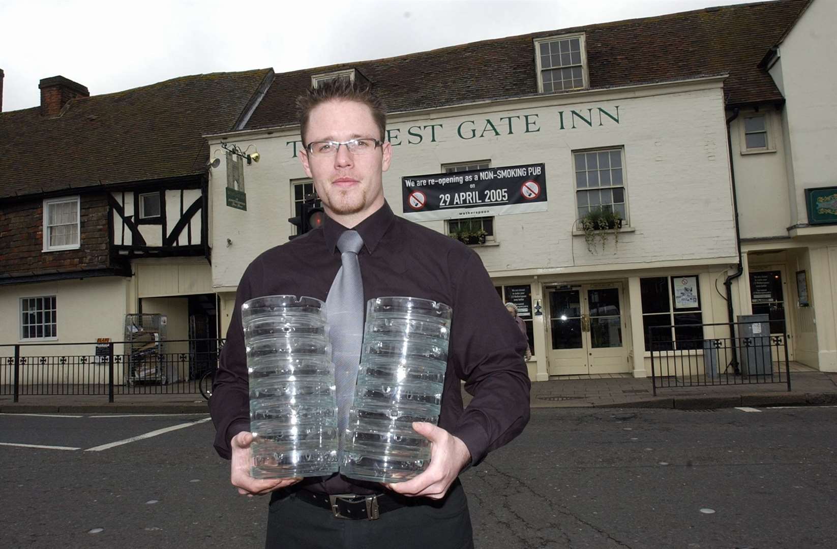 In 2005 the West Gate Inn became the first non-smoking pub in the city. Manager Ian Feltham is pictured with a pile of redundant ash trays destined for the bin.