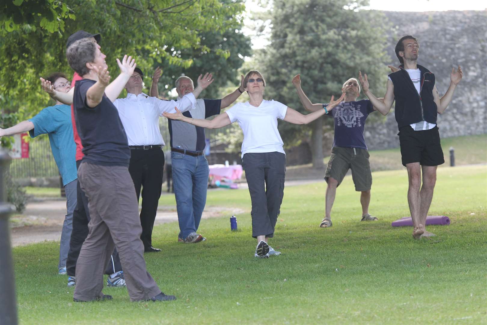 People trying tai chi outdoors