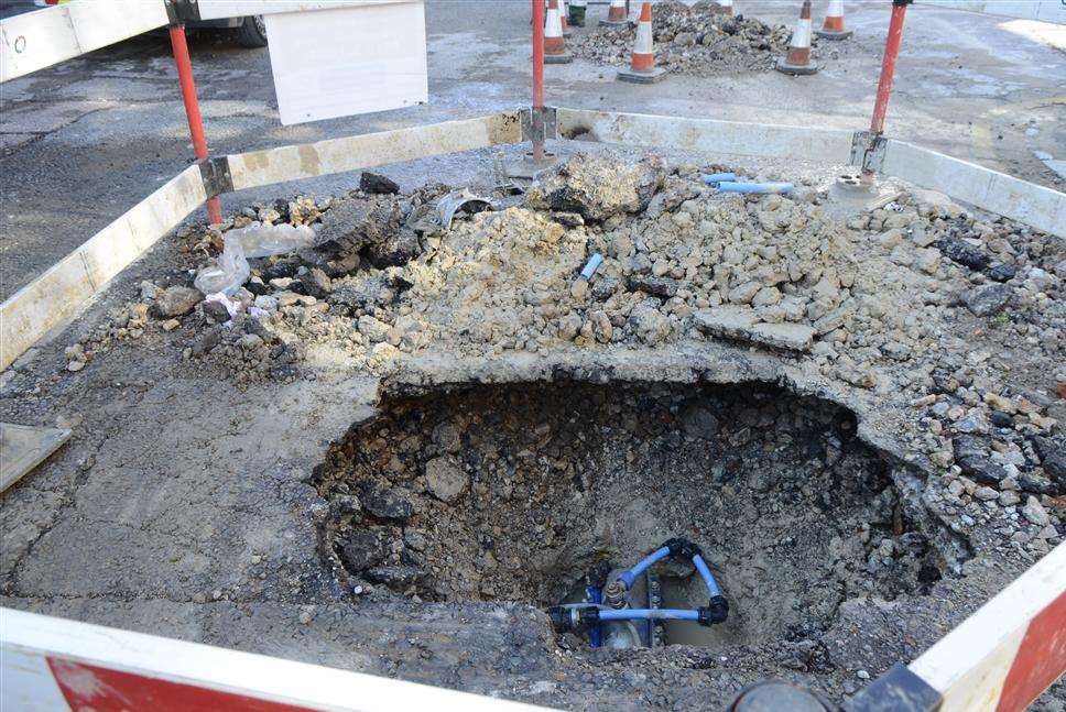The huge hole left after the water mains exploded