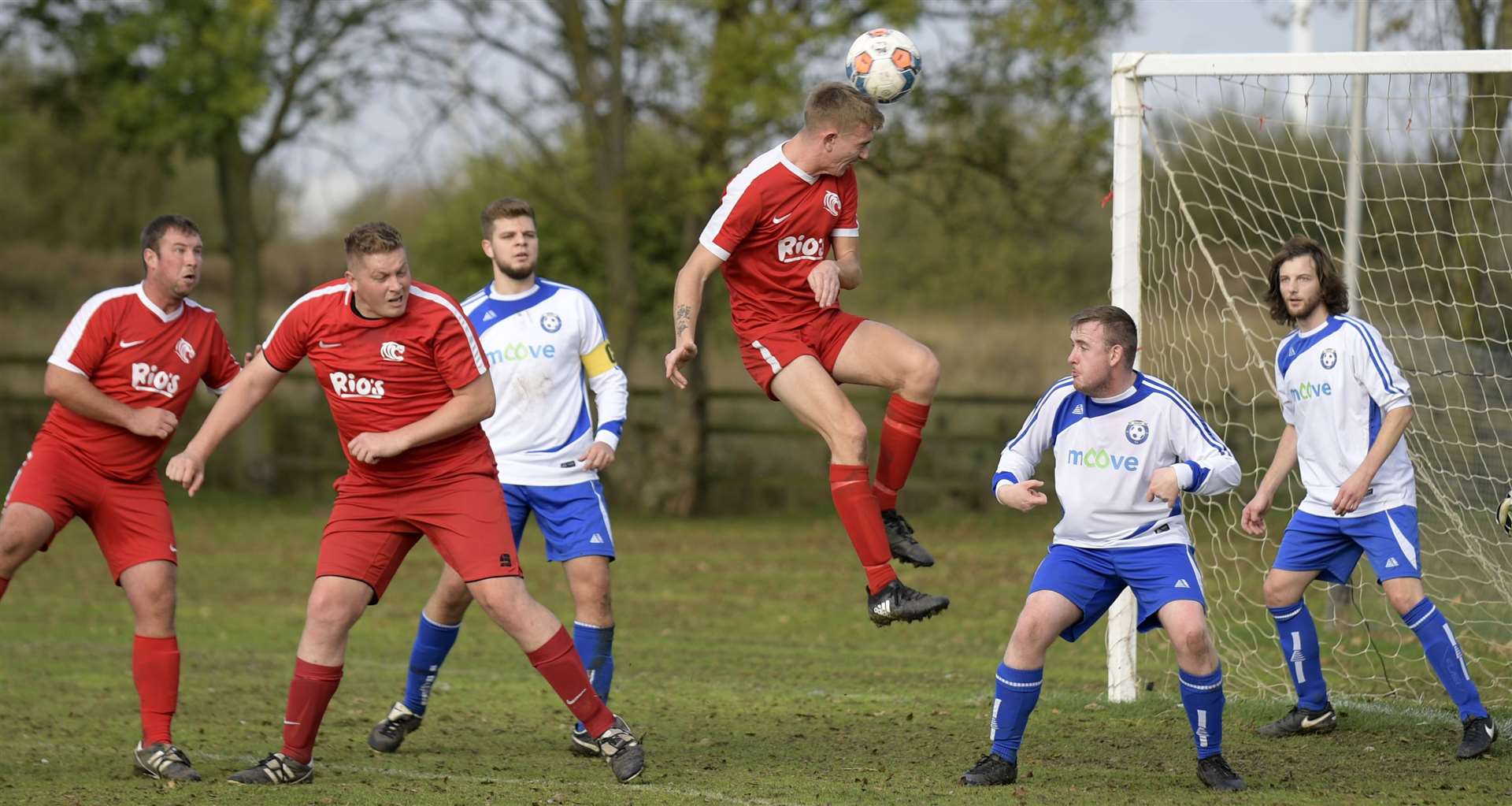AFC Tigers (red) win a header in the penalty area against Moove. Picture: Barry Goodwin (42745140)