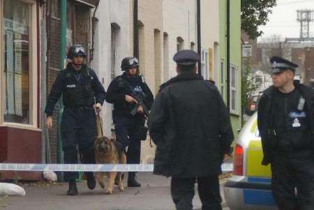 Police officers, some armed, at the scene. Picture: BARRY CRAYFORD