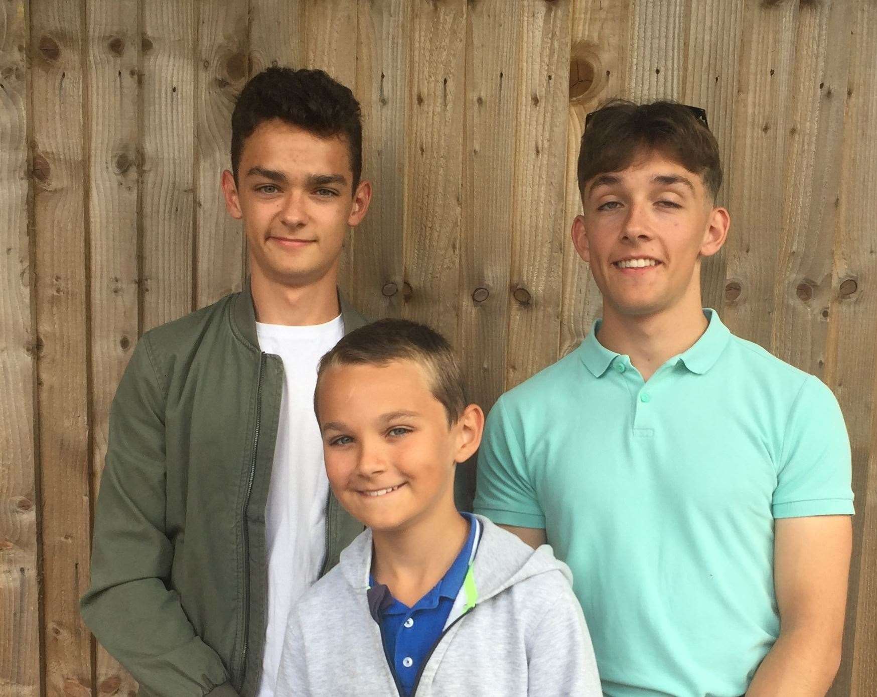 Toby Smith, 12, with brothers Jake and Luke, both 18. Picture: Barton Court